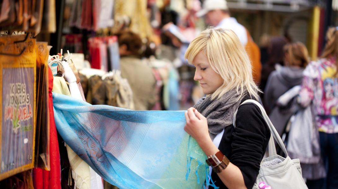 Volunteer learns about ethical consumerism and fast fashion in Cambodia. Traveller explores a local market in Cambodia.
